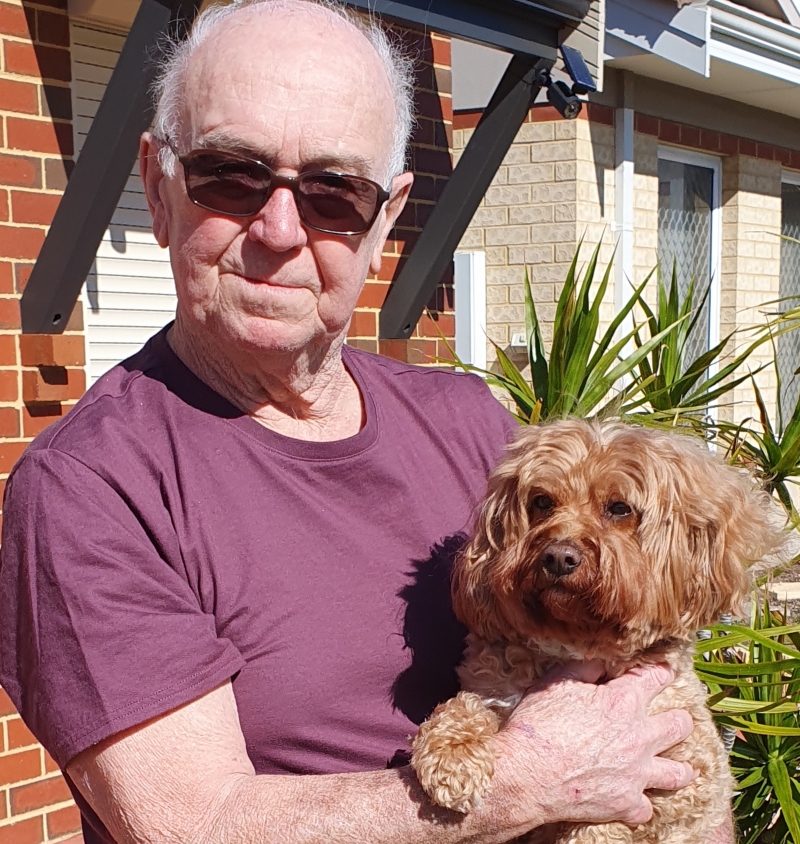 Robert Lampshire with his dog in the garden